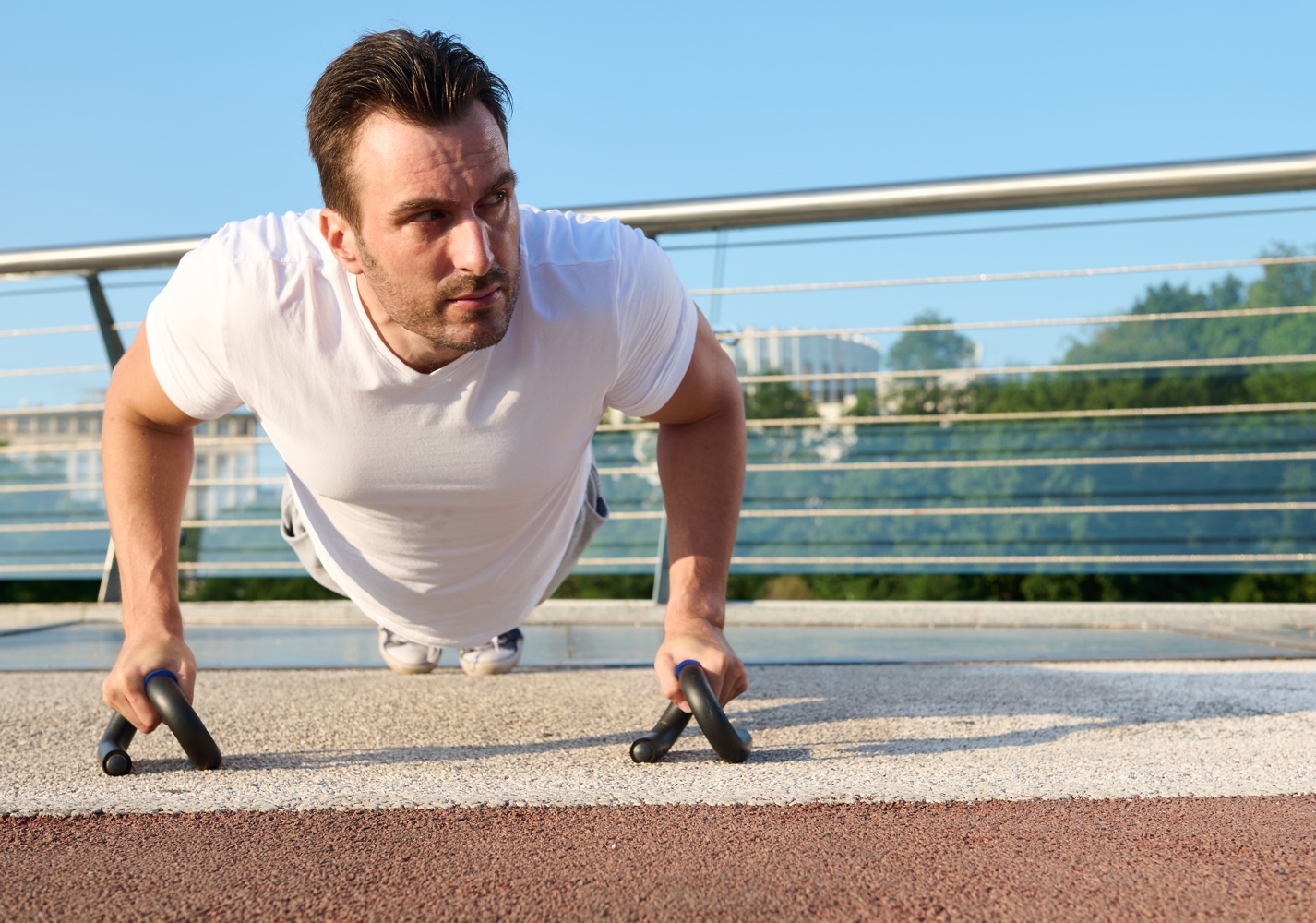 closeup-determined-handsome-middle-aged-man-athlete-exercising-outdoor-pumping-muscles-while-performing-pushups-training-urban-bridge-beautiful-summer-day